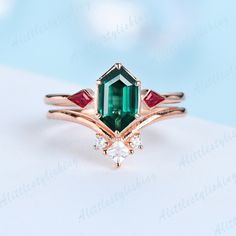 Emerald Ruby Wedding Ring Set, Art Deco Emerald Engagement Ring, Bridal Set, Unique Curve Wedding Band ❈Item detail❈ ✼Engagement ring: -Main stone: 5x9mm Long Hexagon cut Lab created Emerald -Side stones: Kite Cut 0.22ct Lab created Ruby -Material:925 sterling silver/ white gold plated/ rose gold plated / yellow gold plated / 10K/14K/18K solid gold available ✼Wedding band: -Stones: Princess & Round cut 0.15ctw Moissanite stones -Material:925 sterling silver/ white gold plated/ rose gold plated / Emerald Marquise Cut Diamond Wedding Ring, Marquise Cut Emerald Diamond Wedding Ring, Emerald-cut Diamond Ring For Wedding, Emerald-cut Diamond Wedding Ring, Art Deco Emerald Wedding Ring, Art Deco Green Diamond Ring For Wedding, Elegant Green Ruby Wedding Ring, Art Deco Green Diamond Wedding Ring, Wedding Diamond Ring With May Birthstone In Emerald Cut