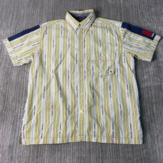 Vintage 2000s Tommy Jeans One Pocket Striped Pattern Basic Essential Streetwear Style Y2K Aesthetic Yellow Button Up Shirt Medium Mens Condition:  Excellent Used Condition  = No Flaws Measurements: Please see photos above for all measurements IF YOU BUY TWO OR MORE ITEMS USE THE CODE BUNDLE @ CHECK TO SAVE 20% WE SHIP WITHIN 24 HOURS AFTER PURCHASE! Please be aware that we do not offer free returns!! The Buyer is responsible for the cost of the return label.  Follow us on TikTok & Instagram @findsnostalgic and tag us in your finds Casual Button Shirt For Streetwear, Casual Streetwear Shirt With Buttons, 90s Collared Tops For Streetwear, 90s Style Streetwear Tops With Pockets, 90s Streetwear Tops With Pockets, 90s Short Sleeve Tops With Button Closure, 90s Style Cotton Collared Shirt, 90s Cotton Collared Shirt, 90s Style Collared Shirt With Button Closure