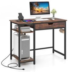 a computer desk with a desktop on top of it and an air conditioner under the desk