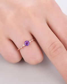 A 5mm round Cut Natural Amethyst ring Accent stone: white CZ The stones of the ring can be replace with other different kinds of gemstone such as morganite, aquamarine, amethyst, citrine, white CZ, pink CZ,etc. If you want to customize your own personal ring, please feel free to contact with me. (925 sterling silver white/yellow/rose gold plated or solid 14k white/yellow/rose gold are available) 14 days money back guarantee. Dainty Amethyst Wedding Ring With Prong Setting, Round Birthstone Jewelry For Wedding, Purple Cubic Zirconia Jewelry With Brilliant Cut, Rose Gold Sapphire Ring With Diamond, Purple Brilliant Cut Cubic Zirconia Jewelry, Cubic Zirconia Birthstone Jewelry In Round Band, Formal Crystal Ring With Birthstone In Round Cut, Cubic Zirconia Crystal Ring With Gemstone In Round Band, Cubic Zirconia Birthstone Jewelry With Round Band