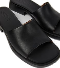 Modern Slip-on Slides With Textured Sole, Modern Slip-on Slides With Leather Sole, Sleek Leather Slides For Summer, Modern Synthetic Slip-on Slides, Modern Slip-on Synthetic Slides, Comfortable Leather Slides For Everyday, Everyday Leather Mules With Textured Sole, Everyday Leather Slip-on Slides, Everyday Comfortable Leather Slides