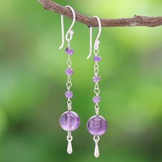 Matta in Thailand uses smooth purple gems to hand craft her lovely pair of dangle earrings. The artisan begins with a large amethyst orb which swings from a column of faceted amethyst gems. A silver-plated brass bead dangles below the orb while sterling silver hooks accents add shine and opulence. Chain Earrings Dangle Diy, Dangly Purple Earrings, Amethyst Long Drop Earrings For Pierced Ears, Purple Wire Wrapped Long Drop Jewelry, Nickel Free Amethyst Dangle Earrings, Nickel-free Amethyst Dangle Earrings, Lavender Amethyst Dangle Earrings, Handmade Amethyst Long Drop Jewelry, Purple Amethyst Jewelry With Ear Wire