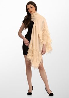 This beige scarf is woven from the finest premium cashmere. It features a smattering of tonal beige sequin across the scarf with the delicate application of beige ostrich feathers at the long ends. Meticulously hand crafted, this scarf is the perfect fusion of opulence, glamour and sophistication. The application of ostrich feathers add a touch of extravagance whilst the scattered sequin introduces a subtle sparkle. Whether draped casually for everyday chic or worn on special occasions, this stu Beige Scarf, Everyday Chic, Ostrich Feathers, Cashmere Scarf, Timeless Beauty, Feathers, Sequin, Special Occasion, Hand Crafted