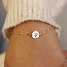 Sterling silver Tree of Life Hand stamped personalized disc bracelet with a sterling silver chain is uniquely hand crafted for you in Melt'm Jewelry Studio in Redlands, California. Handmade from high-quality Sterling Silver. This bracelet features a cute custom disc that hand stamped with a tree of life. It makes a thoughtful and heartfelt gift for moms, grandmothers, sisters, friends, and more. * Sterling silver disc is 9.5mm diameter. * Tree of Life stamped by hand. * Smooth finish, hammered o Adjustable Sterling Silver Bracelet As A Gift, Adjustable Sterling Silver Round Bracelet As A Gift, Adjustable Round Sterling Silver Bracelet As Gift, Adjustable Round Sterling Silver Bracelet For Gifts, Customizable Silver Charm Bracelet For Friendship, Dainty Sterling Silver Charm Bracelet For Personalized Gift, Adjustable Sterling Silver Engraved Chain Bracelet, Meaningful Sterling Silver Friendship Bracelets, Dainty Customizable Silver Bracelet