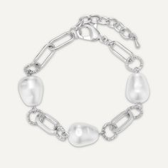 Add some elegant luxury to your jewellery box with this pearl bracelet. Featuring interlocking chain links and faux pearls on a classic rhodium plated bracelet. Rhodium Plated | Nickel, Lead, and Cadmium Free Product Code: DB2109R Collection: Audrey Type: Clasp Material: Base Alloy & Faux Pearls Dimensions: Length 20-24cm Pendant Dimensions: Style: Vintage & Chain-Link Includes: Vintage Chain, Free Product, Chain Links, Bracelet Clasps, Short Necklace, Pearl Chain, Keep Jewelry, Pearl Drop Earrings, Everyday Jewelry