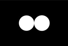 two white circles in the middle of a black background, one is larger than the other