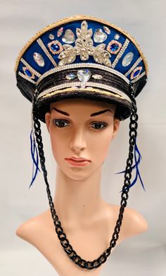 This is a one off unique designed captain hat. It has jewelled front with black plastic thick chain and blue feathers. This will get you noticed. It is a size 59cm which fits most heads. Blue Costume Hat For Carnival, Punk Style Party Cap Hat, Punk Style High Crown Mini Hat For Party, Punk Style Mini Hat With High Crown For Party, Blue Adjustable Costume Hats For Carnival, Adjustable Blue Costume Hats For Carnival, High Crown Costume Hat For Carnival Festival, High Crown Costume Hats For Carnival, Blue Costume Hats And Headpieces For Carnival