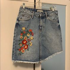 Asymmetrical Denim Skirt With Frayed Hem And Flower Embroidery Detail With Two Beaded Yellow Flowers. Front Pockets And Back Pockets. Brand New Without Tag. Length: 17 Inches Longest Point On Front 16 Inches Back Waist: 14.5 Inches Across Front Summer Cotton Denim Skirt With Floral Embroidery, Casual Denim Skirt With Floral Embroidery, Asymmetrical Denim Skirt With Frayed Hem For Spring, Summer Floral Embroidered Denim Skirt, Casual Embroidered Zara Skirt, Casual Embroidered Skirt By Zara, Casual Embroidered Skirt From Zara, Zara Bottoms With Floral Embroidery For Spring, Embroidered Denim Skirt For Spring