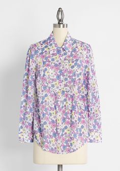 You belong among the wildflowers in this vintage-inspired shirt from our ModCloth namesake label. Made from an airy cotton-blend, this white top is adorned in an exclusive and romantic print of daisies in shades of purple, blue, white, and yellow. Boasting button cuffs, a unique bib front with a point collar, and button-front closure, this breezy retro-chic blouse offers subtle shirring at the yoke seam is truly unique and looks awesome paired with country Western-inspired boots. Cotton. Machine