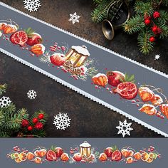 a christmas themed table runner with pomegranates, oranges and cranberries