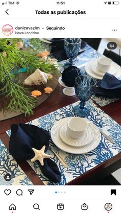 the table is set with blue and white dishes