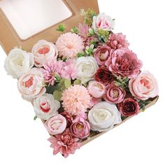 a wooden box filled with pink and white flowers