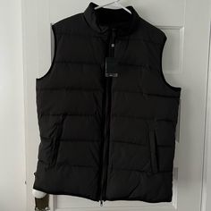 New With Tags Pronto Uomo Puffer Vest. Size Medium. Snap Pockets. Interior Pocket. Velvet Trim. Has Two Small Marks From The Store - One Shown In Picture 6 & The Other In Picture 9. Black Fitted Vest For Cold Weather, Fitted Black Vest For Cold Weather, Velvet Trim, Puffer Vest, The Store, Puffer, Mens Jackets, Velvet, Trim