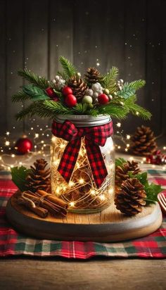 a mason jar filled with pine cones and christmas lights sitting on top of a table