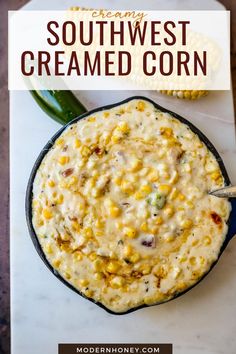 a bowl filled with creamed corn on top of a table