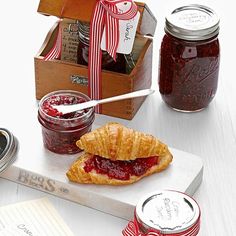 jams and croissants are sitting on a table