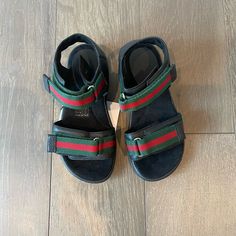 Brand New Never Been Worn Red And Green Details Gucci Kids Sandals With Velcro Straps. Gucci Green Sandals With Round Toe, Gucci Red Round Toe Sandals, Gucci Leather Flat Sandals, Gucci Leather Sandals Flat Heel, Black Gucci Sandals For Summer, Designer Gucci Green Sandals, Designer Green Gucci Sandals, Casual Gucci Leather Sandals, Casual Red Gucci Sandals