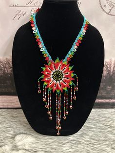 Beautiful set of handmade Tepeyac necklace, earrings and bracelets, handmade by Mexican artisans. Traditional Handwoven Necklaces For Jewelry Making, Traditional Handmade Long Beaded Necklace, Artisan Jewelry With Colorful Adjustable Beads, Gift Red Handwoven Beaded Necklaces, Artisan Adjustable Colorful Beaded Jewelry, Artisan Long Necklace For Festivals, Artisan Multicolor Hand-strung Necklaces, Traditional Handwoven Choker As A Gift, Handmade Turquoise Bracelet Jewelry