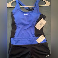 Blue And Black Nike Swimsuit Set. Size Xs Women’s, True To Size. New With Tags- Excellent Condition. Scoop Neck Line Style. Original Price $100 Paid $50 Did Not Wear Selling For $45 Fitted Blue Nike Swimwear, Nike Athleisure Swimwear, Nike Fitted Sleeveless Swimwear, Nike Stretch Athleisure Swimwear, Nike Fitted Casual Swimwear, Nike Athleisure Swimwear For Workout, Sporty Fitted One-piece Tankini, Fitted Sleeveless Nike Swimwear, Nike One-piece Swimwear For Sports