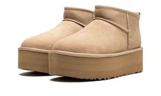 The Women’s Ugg Classic Ultra Mini Platform “Sand” is the women’s sizing of the slip-on boot with an exaggerated platform sole.  Both comfortable and warm due to its wool inner lining and slip-on style foot entry, the Ugg Classic Ultra Mini Platform at hand features a Sand-colored suede construction with raised seams.  A pull tab on the heel assists with on/off wearability.  The tan rubber platform-style sole provides a significant boost in height to the wearer, and the EVA foam sole has a tract 70s Converse, Ugg Ultra Mini, Nike X Travis Scott, Converse Run Star Hike, Ugg Classic Ultra Mini, Converse Run Star, Ugg Mini, Jordan 2, Nike Dunk High