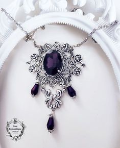 Beautiful silver ornaments decorated with purple gem Gothic Purple Metal Jewelry, Gothic Purple Jewelry Gift, Ornate Silver Baroque Necklaces, Elegant Purple Metal Necklace, Gothic Antique Silver Jewelry For Formal Occasions, Gothic Filigree Pendant Jewelry, Gothic Sterling Silver Necklace, Antique Silver Gothic Jewelry For Formal Occasions, Gothic Sterling Silver Jewelry With Intricate Design