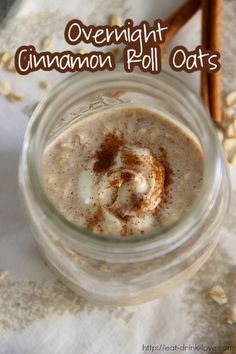 a glass jar filled with food sitting on top of a white table cloth next to cinnamon sticks