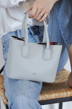 Cher Micro, the smallest version of the Cher Tote with the same design and richness, carries your essentials in a compact size. Compared to the tote and mini, the micro offers more playfulness and trendiness. Named after ‘Cher’, the it-girl with a rich taste of trend and the central protagonist of 'Clueless’,  #affiliatelink #gray #hamilton #crossbody #handbas #trends #handbags2019trends #handbags2020trends Mom Purses, Vegan Tote Bag, Purse Style, Fabric Handbags, Green Handbag, Popular Handbags, Vegan Leather Handbag, Handbag Pattern, Bags School