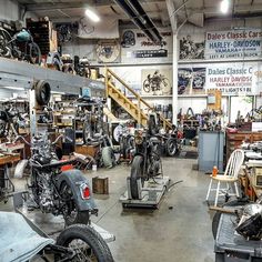 a garage filled with lots of different types of motorcycles