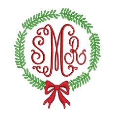 a monogrammed wreath with a red bow and the letter m