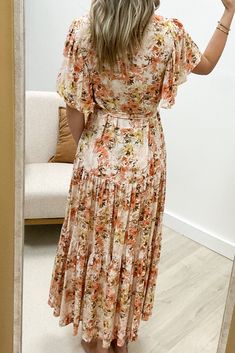 This "Blooming With Grace" Maxi Dress in Ginger is perfect for any occasion. Made from a lovely flower print linen blend woven fabric, it features a surplice v-neck with hook and eye closure, short flutter sleeves, and a loose waist with a detachable waist tie and belt loops. The ruffle tier detail on the skirt adds a touch of fun to this stunning maxi dress. 80% Rayon, 20% Linen Jaclyn is a size 1, wearing a small. Ginger Dress, Mini Shirt Dress, Printed Linen, Flutter Sleeves, Flower Print, Waist Tie, Long Tops, Short Tops, T Shirt Dress