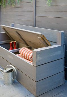 an outdoor storage box is open on the patio