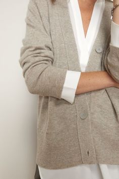 V-neck Cardigan With Button Cuffs For Work, Classic V-neck Cardigan With Button Cuffs, Classic V-neck Outerwear With Buttons, Neutral V-neck Cardigan For Work, Classic Spring Cardigan For Layering, Classic Neutral Tops For Layering, Relaxed Fit V-neck Cardigan For Daywear, Classic Neutral Cardigan For Layering, Elegant Cashmere Cardigan With Relaxed Fit