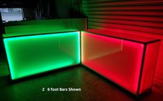 three different colored lights are in the corner of a room with red and green walls