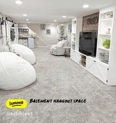 a living room filled with furniture and a flat screen tv on top of a white entertainment center