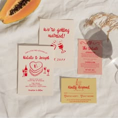 the wedding stationery is laid out on paper