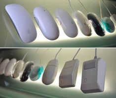 several different types of mouses are hanging on the wall and in front of each other