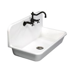 a white sink sitting under a faucet