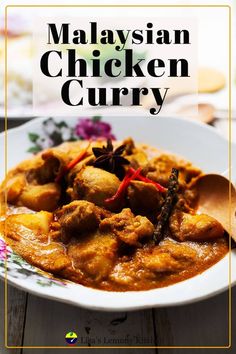 malaysian chicken curry in a white bowl with a wooden spoon on the side and text overlay that reads malaysia chicken curry