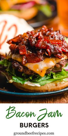 the bacon and cheese burger is served on a bun with lettuce