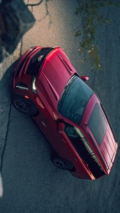 the top view of a red sports car from above