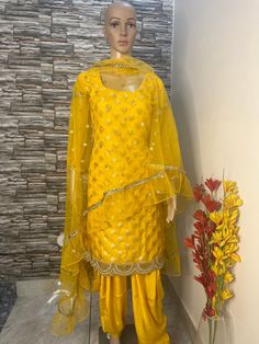 This is 3 piece salwar suit.custom made party wear outfit. Top is made in banarse brocade fabric . Dupatta in net fabric. Salwar in silk fabric. Stitching  For stitched dresses you can chose from size chart or can message us for customization.our team will send you size chart for customization. Feel free to convo for any details to help you in your selection because customize dresses cannot be return or exchange. Note: color may slightly vary because of different screen resolutions. We have an e Semi-stitched Shantoon Sharara With Gota Work, Festival Salwar Kameez With Gota Work In Shantoon, Semi-stitched Shantoon Sharara For Festivals, Traditional Organza Dress For Festivals, Bollywood Style Shantoon Sharara For Diwali, Party Yellow Salwar Kameez With Dabka Work, Yellow Kurta With Sheer Dupatta For Party, Yellow Organza Kurta With Zari Work, Yellow Organza Kurta For Festivals