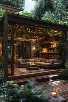 an outdoor living area is lit up with lights