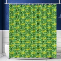 a green shower curtain in a bathroom with blue walls