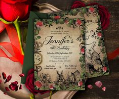 a couple of red roses sitting on top of a table next to a green and white card