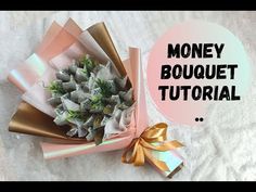 a bouquet of flowers sitting on top of a white sheet with the words money bouquet