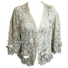 Wonderful Edwardian Crochet Lace Bolero Jacket with huge 3 dimensional florals throughout including large Orchid blooms along the hem and sleeves. The flowers are so dimensional that each petal and stamen is hand crochet. Extraordinary workmanship from the early 20th Century. Front length 22". back length 16", bust 30", 20" overarm. Fitted Elegant Cardigan With Floral Print, Elegant Fitted Cardigan With Floral Print, Elegant Crochet Lace Cardigan, Spring Wedding Lace Outerwear, Crochet Lace Bolero, Edwardian Crochet, Crochet Orchid, 1900 Clothing, Interesting Dresses