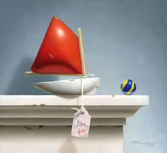 a red sailboat sitting on top of a white mantle