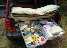 the back end of a van filled with food and drinks