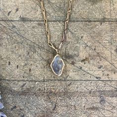 Simple and understated; Fiery labradorite is embedded in brass and anchored on our signature brass chain with a handmade clasp. Beautiful on its own or the perfect layering piece. Pendant Length 5/8" Width 3/8" Chain Length 16" - 18" This piece is handmade-to-order, please allow 1 - 2 weeks to ship unless this piece is in stock. Each piece will vary slightly due to the uniqueness of the stones. All metal is nickel free. Hand Forged Gold Moonstone Jewelry, Gold Hand Forged Moonstone Jewelry, Hand Forged Moonstone Gold Jewelry, Gold Hammered Moonstone Jewelry, Artisan Moonstone Gold Jewelry, Artisan Gold Moonstone Jewelry, Gold Labradorite Everyday Jewelry, Everyday Gold Labradorite Jewelry, Artisan Gold Moonstone Necklaces