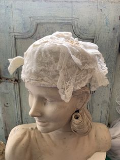 "Beautiful hat of antic lace. With a corsage, also from old lace with pearls. It is a nice , easy wearing model. Middle size Hand made Silk inside Still in perfect condition From France Also nice hanging on an old \"regale\"" Elegant Lace Bonnet With Lace Trim, Vintage Cloche Wedding Headpiece, Fitted Vintage Bonnet With Lace Trim, Vintage Wedding Cloche Headpiece, Adjustable Lace Wedding Bonnet, Vintage Lace With Lace Trim For Ceremony, Wedding Bonnet With Lace Trim, Victorian Cloche Hat For Weddings, Victorian Cloche Wedding Hat